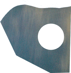 Torn grey-teal paper cutout with a circular hole