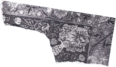 Torn paper cutout with a monochrome floral damask pattern